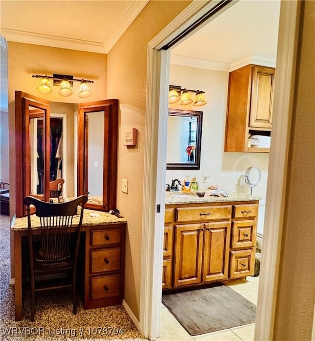 bathroom with vanity, ornamental molding, and toilet