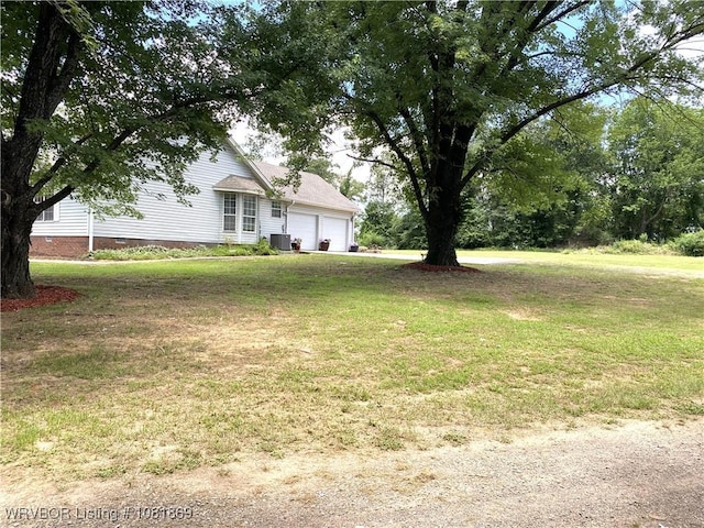 3109 Twin Lakes Pl, Alma, AR 72921 - view of green lawn featuring a garage