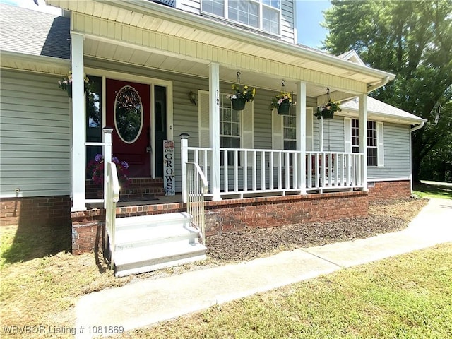 3109 Twin Lakes Pl, Alma, AR 72921 - view of exterior entry featuring a porch and roof with shingles