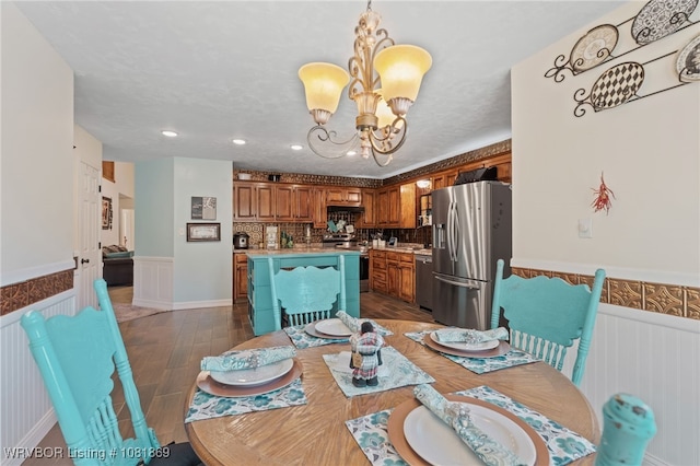 3109 Twin Lakes Pl, Alma, AR 72921 - dining space with a wainscoted wall, a chandelier, dark wood finished floors, and recessed lighting