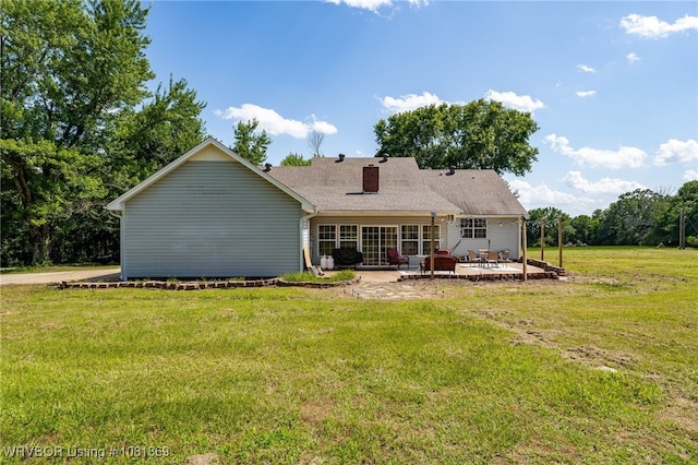3109 Twin Lakes Pl, Alma, AR 72921 - rear view of house featuring a patio, a chimney, and a lawn