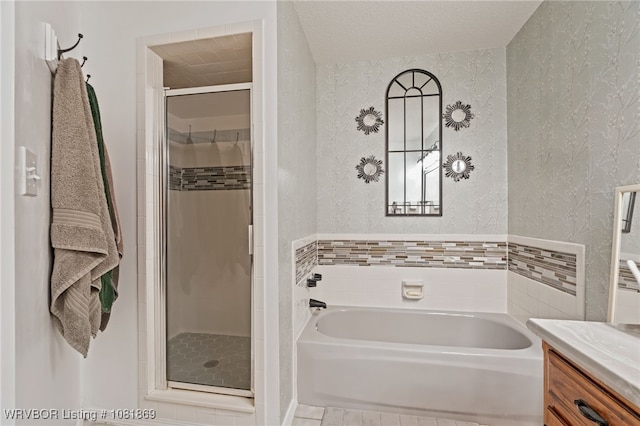 3109 Twin Lakes Pl, Alma, AR 72921 - full bath featuring a bath, a shower stall, vanity, and a textured wall