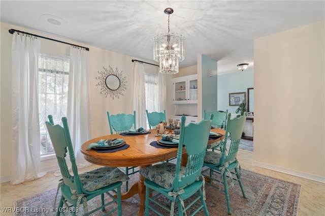 3109 Twin Lakes Pl, Alma, AR 72921 - dining space featuring a chandelier and baseboards