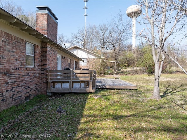 view of yard featuring a wooden deck