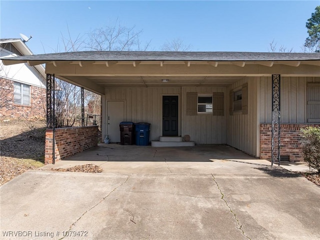 exterior space featuring a carport and driveway