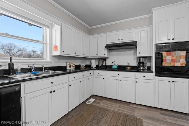 kitchen with visible vents, a sink, black appliances, under cabinet range hood, and crown molding