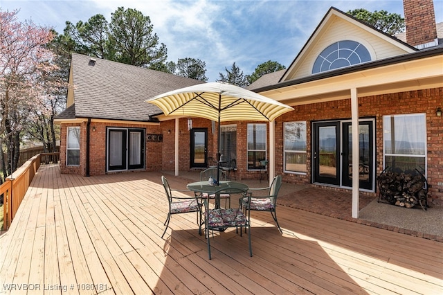 wooden deck with outdoor dining space