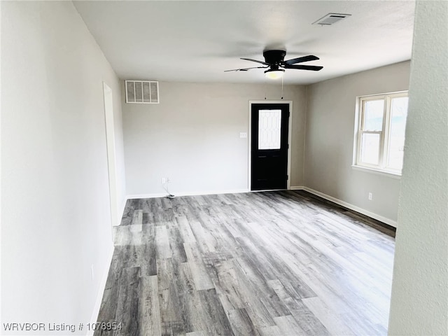 entrance foyer with ceiling fan and light wood-type flooring