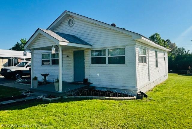 404 Loy Ave, Arkoma, OK 74901 - bungalow with a front lawn
