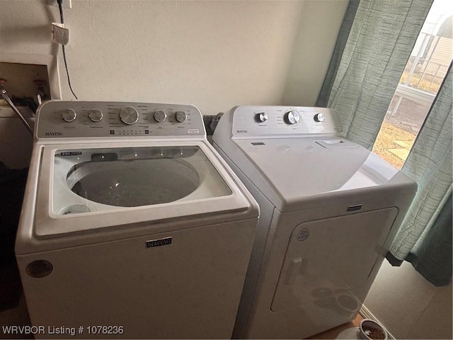 washroom featuring independent washer and dryer