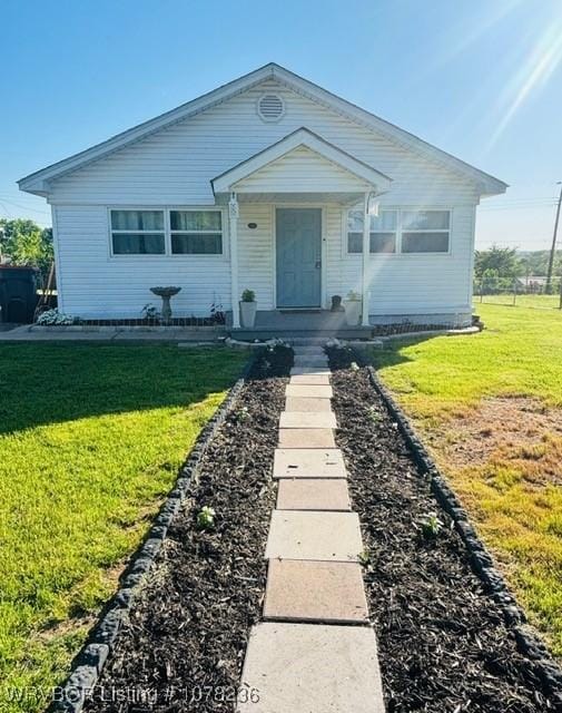 404 Loy Ave, Arkoma, OK 74901 - bungalow featuring a front yard