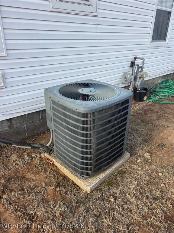 404 Loy Ave, Arkoma, OK 74901 - exterior details featuring gas meter and cooling unit
