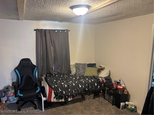 bedroom with carpet and a textured ceiling