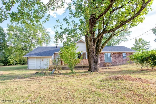 back of house with a lawn and a wooden deck