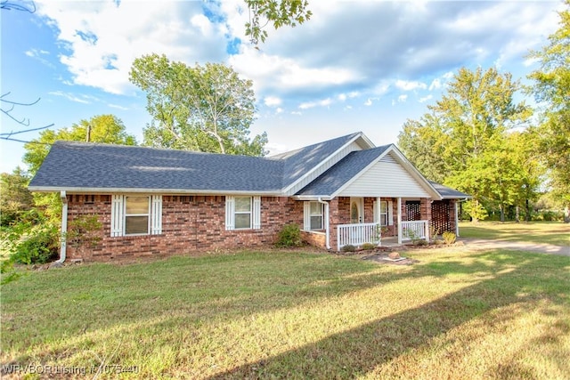 ranch-style house featuring a front yard and a porch