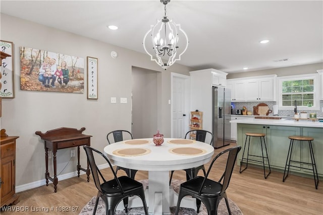 14008 White Bluff Rd, Fort Smith, AR 72916 - dining area with light wood-style floors, a chandelier, and recessed lighting