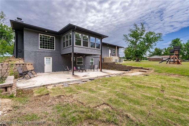 14008 White Bluff Rd, Fort Smith, AR 72916 - rear view of house with a patio area, a yard, stucco siding, and a playground