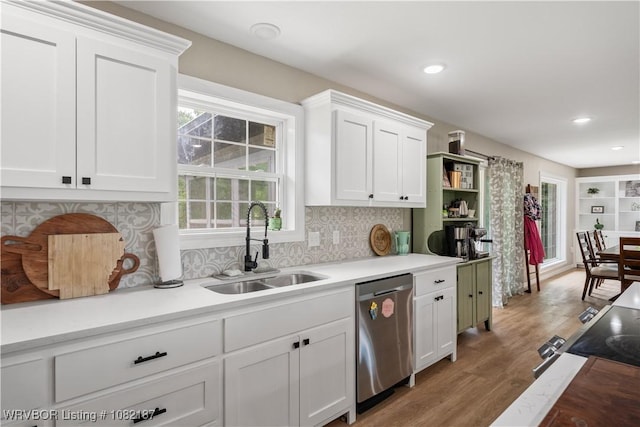 14008 White Bluff Rd, Fort Smith, AR 72916 - kitchen with dishwasher, light countertops, white cabinets, light wood-style flooring, and tasteful backsplash