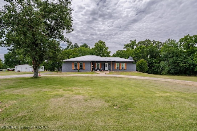14008 White Bluff Rd, Fort Smith, AR 72916 - view of front of home with a front lawn, a chimney, and a metal roof