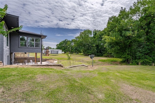 14008 White Bluff Rd, Fort Smith, AR 72916 - view of grassy yard featuring a patio area and an outbuilding