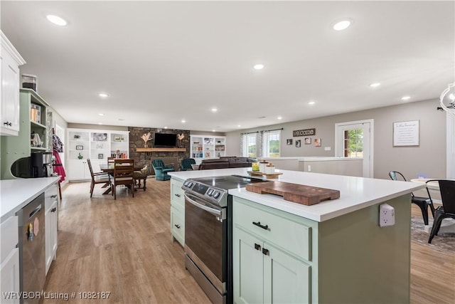 14008 White Bluff Rd, Fort Smith, AR 72916 - kitchen with appliances with stainless steel finishes, light countertops, light wood finished floors, and recessed lighting