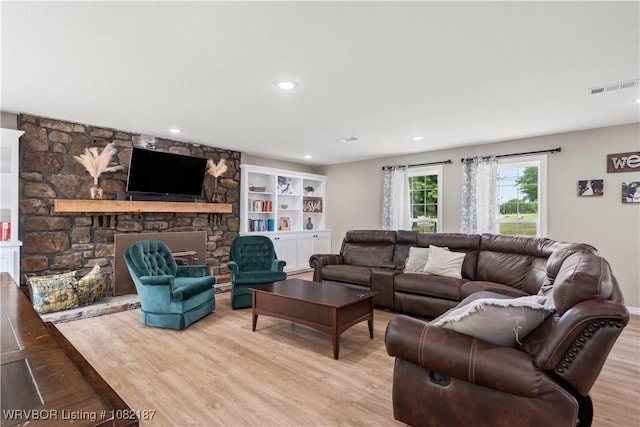 14008 White Bluff Rd, Fort Smith, AR 72916 - living area with light wood finished floors, a fireplace, and recessed lighting