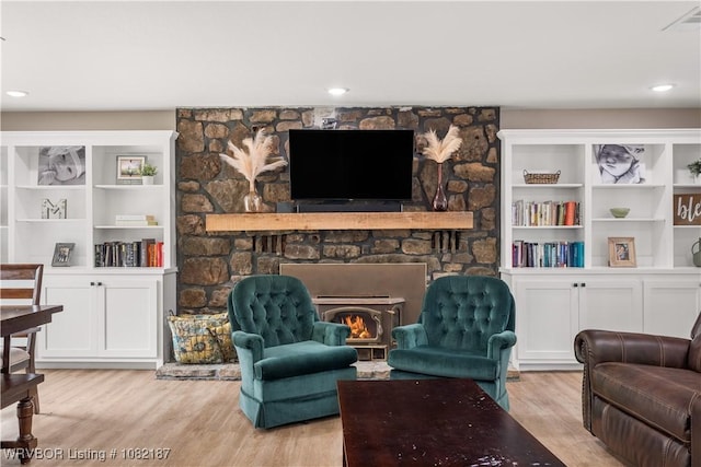 14008 White Bluff Rd, Fort Smith, AR 72916 - living area with a stone fireplace, wood finished floors, and recessed lighting