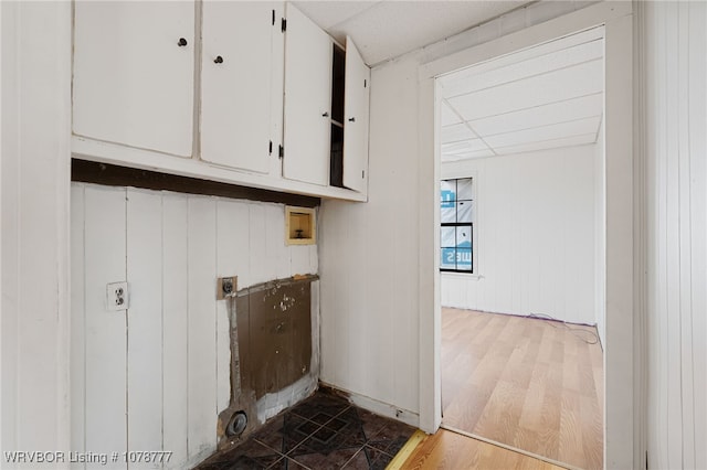 laundry room featuring cabinets, hookup for an electric dryer, hookup for a washing machine, and hardwood / wood-style floors