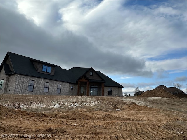 view of front of house with brick siding