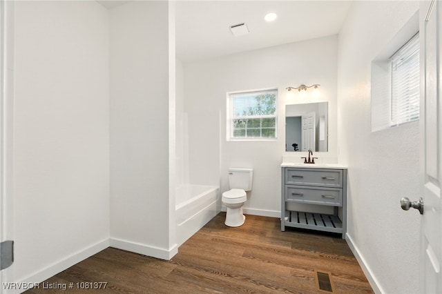 925 Cedar St, Van Buren, AR 72956 - bathroom with toilet, vanity, wood finished floors, and baseboards
