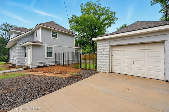 925 Cedar St, Van Buren, AR 72956 - view of side of property with concrete driveway and roof with shingles