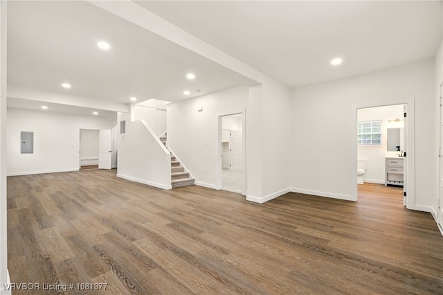 925 Cedar St, Van Buren, AR 72956 - unfurnished living room with electric panel, stairway, dark wood-style flooring, recessed lighting, and baseboards