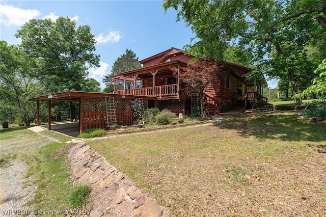 exterior space featuring a carport, a wooden deck, and a front yard