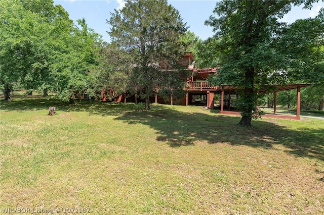 view of yard with a wooden deck