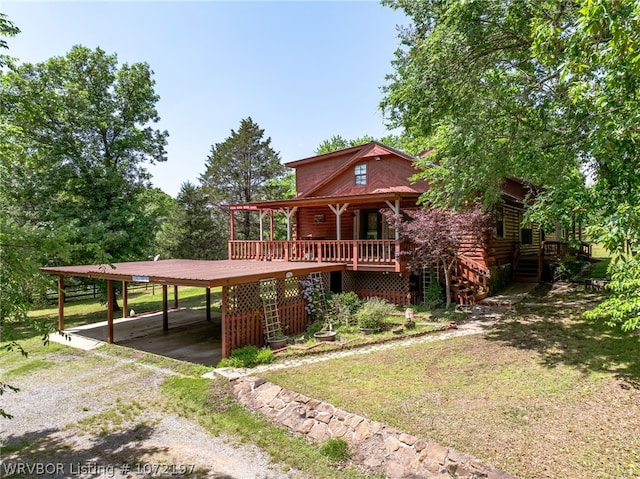 view of front of home with a front lawn and a carport