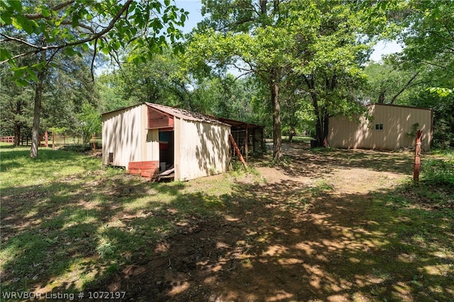 view of outdoor structure with a yard