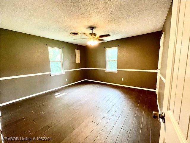 9423 Gate Nine Cutoff, Fort Smith, AR 72916 - spare room with dark wood-style flooring, a textured ceiling, and a ceiling fan