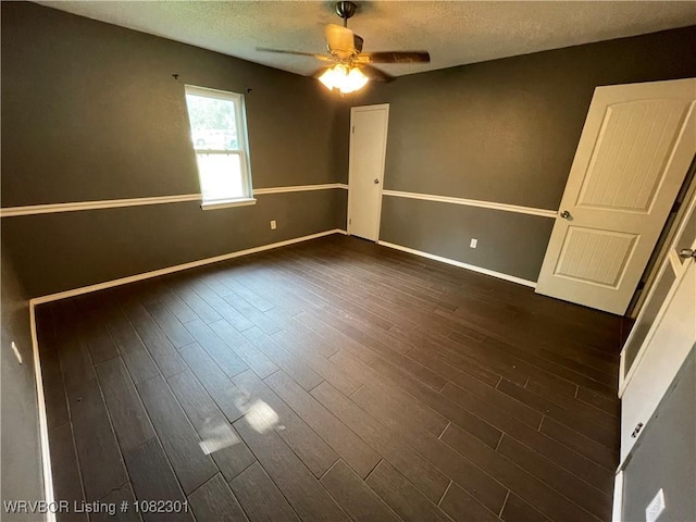 9423 Gate Nine Cutoff, Fort Smith, AR 72916 - empty room featuring a ceiling fan, a textured ceiling, and dark wood finished floors