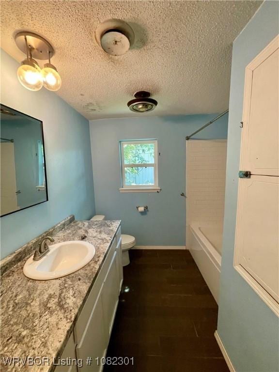 9423 Gate Nine Cutoff, Fort Smith, AR 72916 - bathroom with vanity, a textured ceiling, tub / shower combination, and wood finished floors