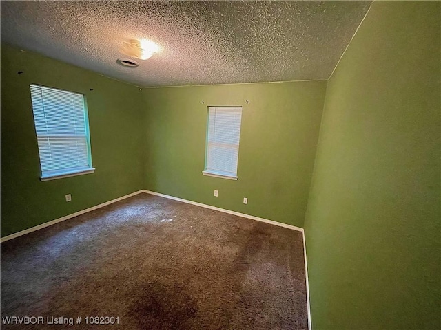 9423 Gate Nine Cutoff, Fort Smith, AR 72916 - spare room with a textured ceiling and carpet
