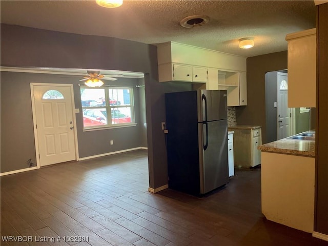 9423 Gate Nine Cutoff, Fort Smith, AR 72916 - kitchen with freestanding refrigerator, white cabinetry, ceiling fan, dark wood-type flooring, and a textured ceiling