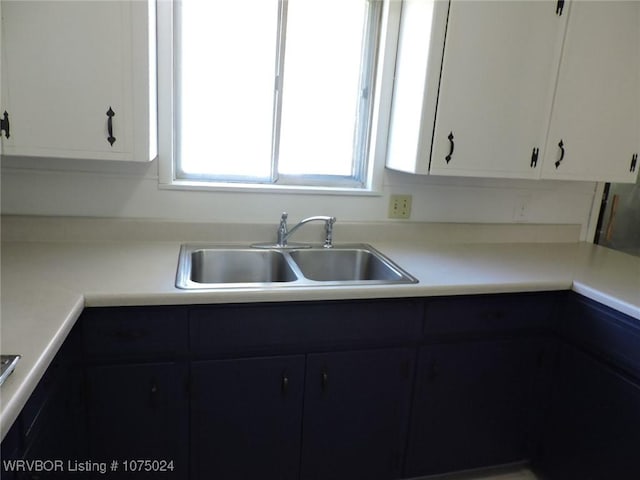 kitchen with sink and white cabinets