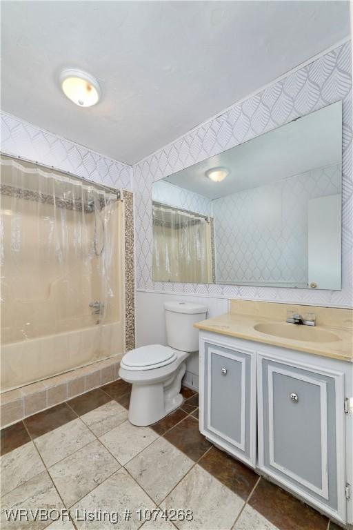 full bathroom with shower / washtub combination, vanity, and toilet