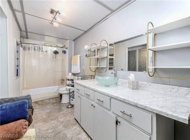 full bathroom with shower / bath combo, vanity, and toilet