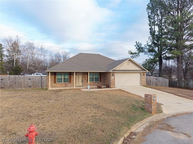 ranch-style home featuring a garage and a front lawn