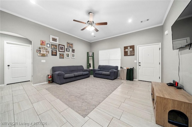 living room featuring ceiling fan and ornamental molding