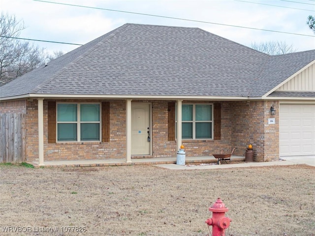 ranch-style house featuring a garage