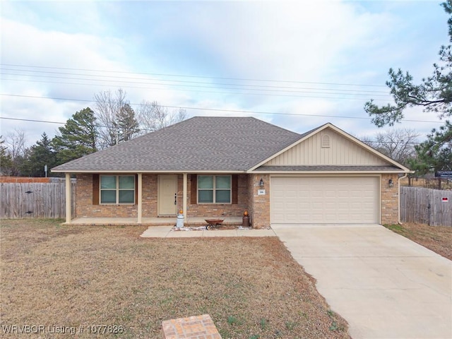 ranch-style home with a front yard and a garage