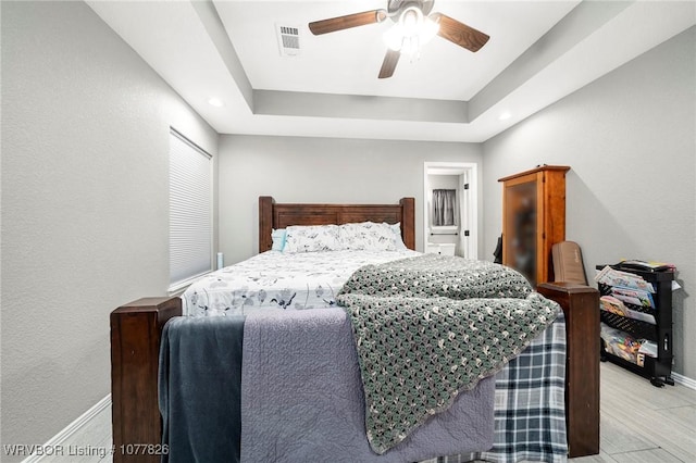 bedroom with ceiling fan and light wood-type flooring