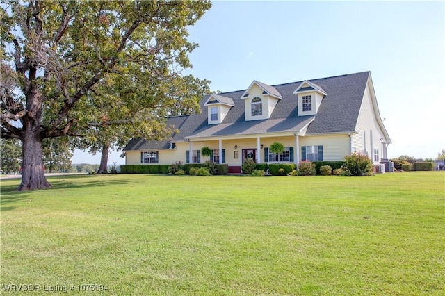 cape cod home with a porch and a front yard